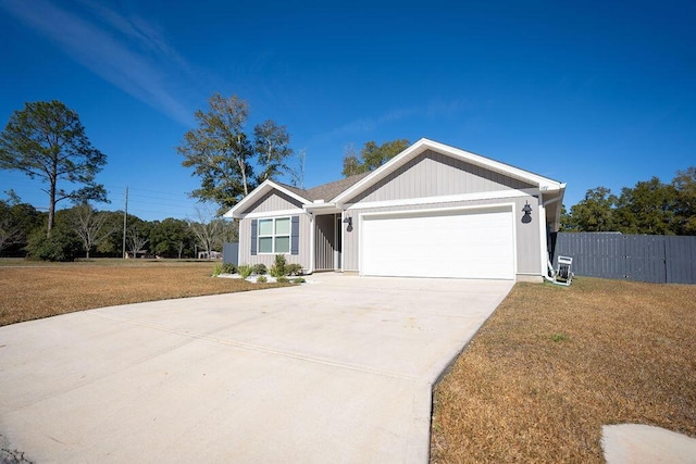 single story home featuring a garage and a front lawn