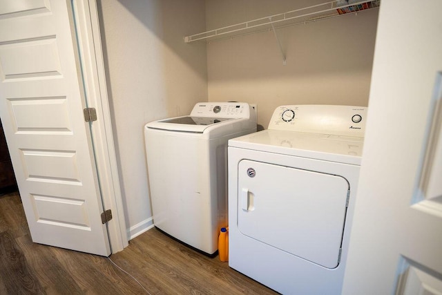 laundry room featuring dark hardwood / wood-style floors and independent washer and dryer