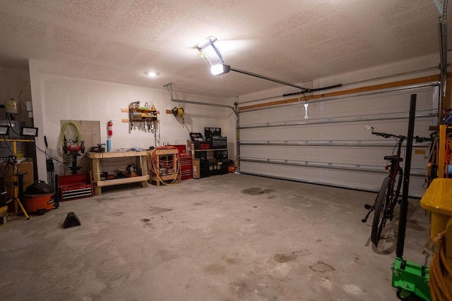 garage featuring a workshop area and a garage door opener