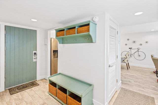 mudroom with hardwood / wood-style floors