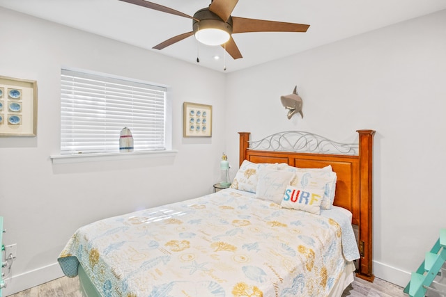 bedroom with ceiling fan and light hardwood / wood-style flooring