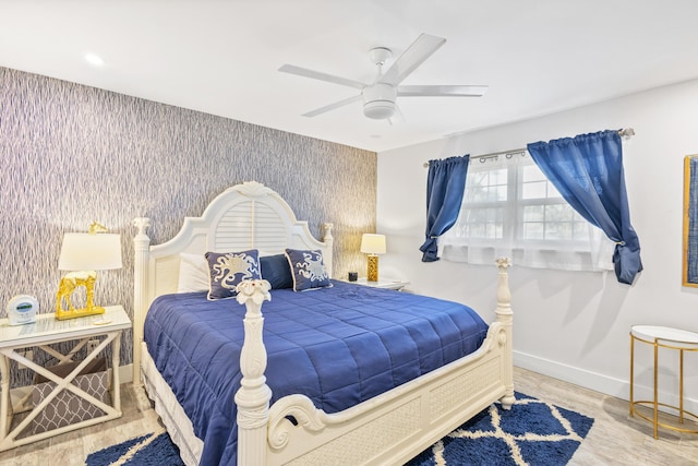 bedroom with hardwood / wood-style floors and ceiling fan