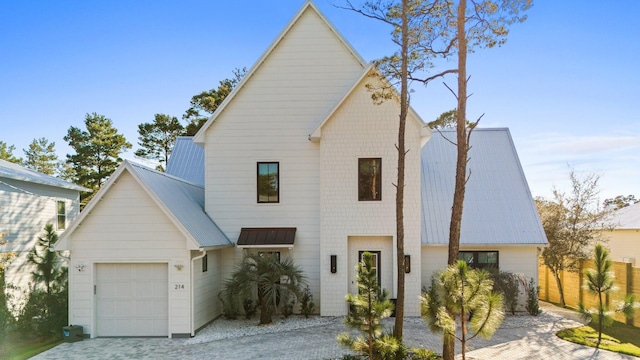 modern inspired farmhouse with a garage