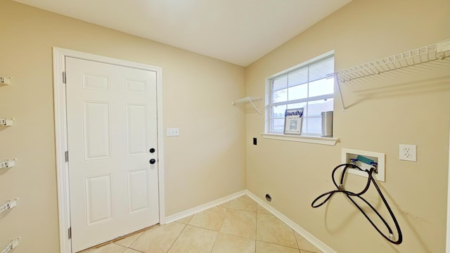 laundry room featuring light tile patterned flooring and hookup for a washing machine