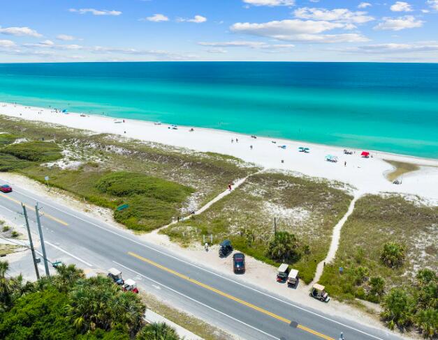 aerial view with a view of the beach and a water view