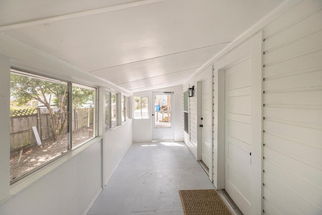 unfurnished sunroom with vaulted ceiling