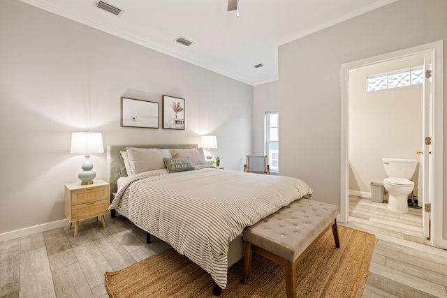 bedroom with ensuite bath, ceiling fan, crown molding, and light hardwood / wood-style floors