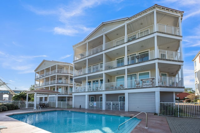 view of swimming pool with a patio