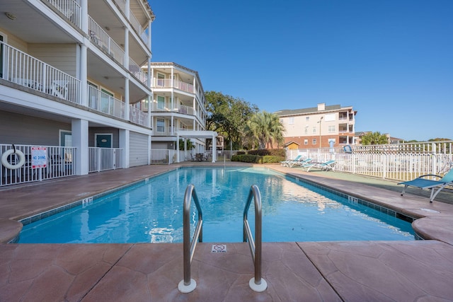 view of swimming pool with a patio area