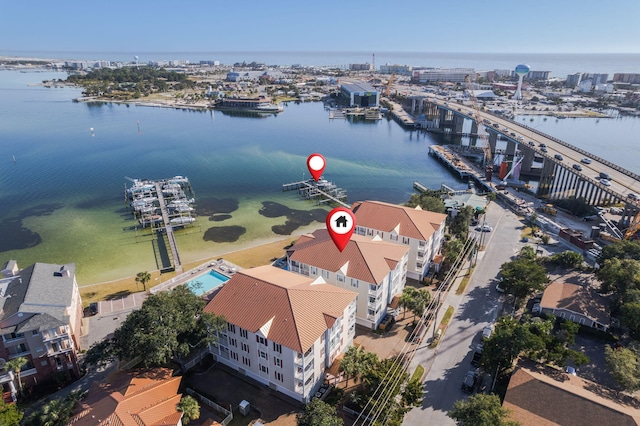 birds eye view of property with a water view