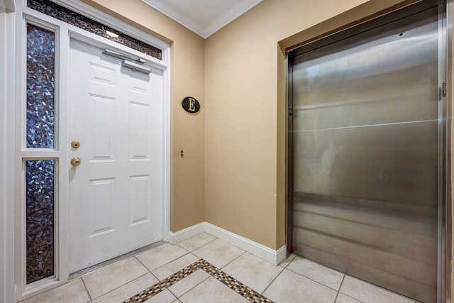 foyer featuring light tile patterned floors and crown molding