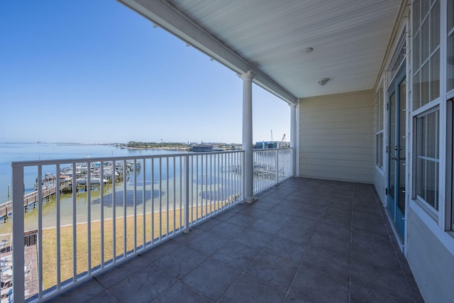 balcony featuring a water view