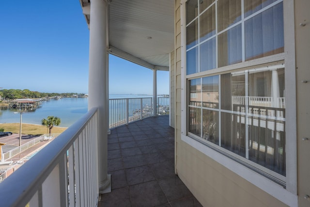 balcony featuring a water view