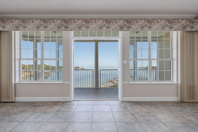 interior space with a wealth of natural light and a water view