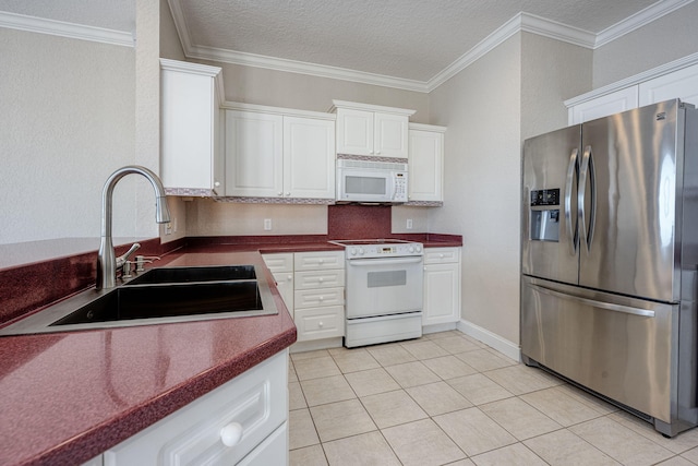 kitchen featuring white cabinetry, sink, light tile patterned floors, and white appliances