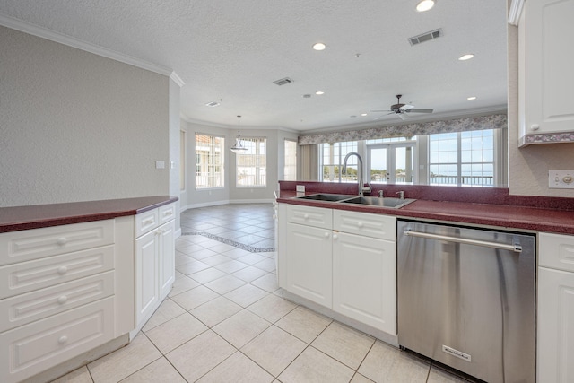 kitchen with sink, stainless steel dishwasher, ceiling fan, light tile patterned floors, and ornamental molding