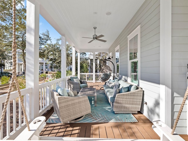 deck with an outdoor hangout area and ceiling fan