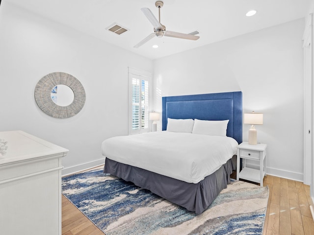 bedroom featuring light hardwood / wood-style flooring and ceiling fan