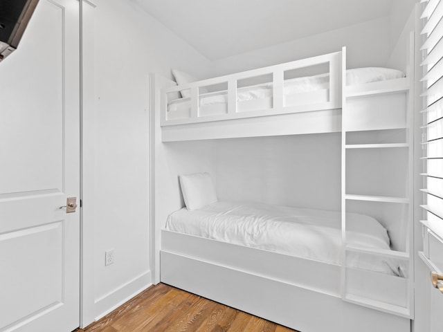 bedroom with wood-type flooring