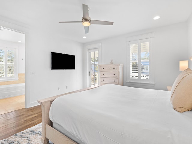 bedroom with ceiling fan and wood-type flooring