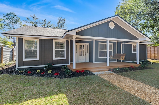 view of front of home featuring a porch and a front yard