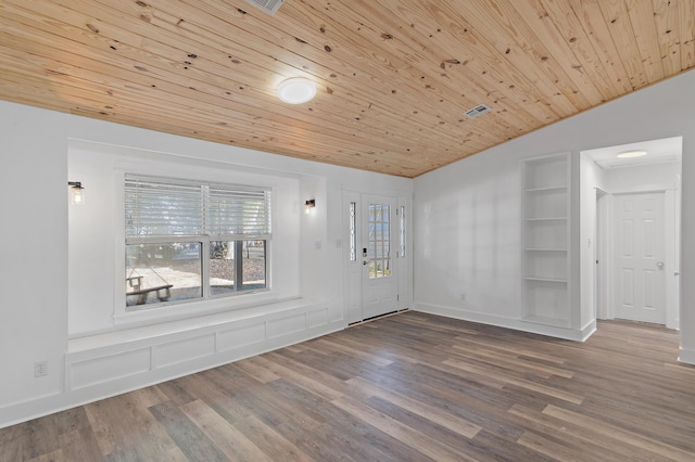 foyer entrance with hardwood / wood-style floors, lofted ceiling, and wood ceiling