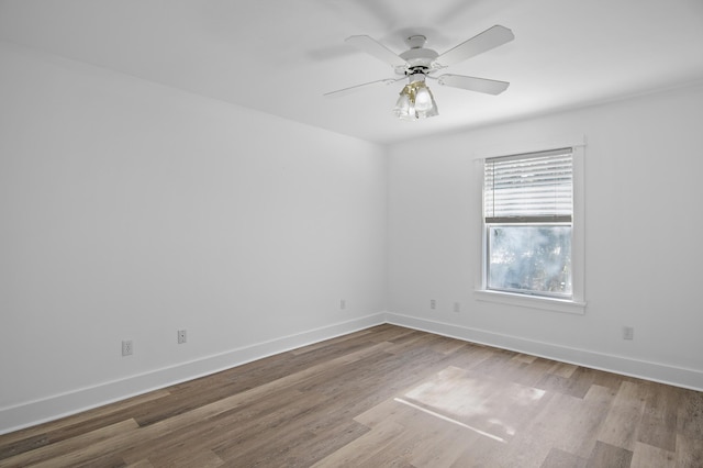 unfurnished room featuring hardwood / wood-style flooring and ceiling fan