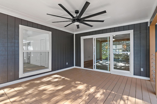 wooden terrace featuring ceiling fan