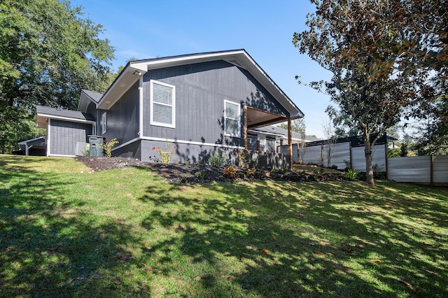 rear view of property with a lawn