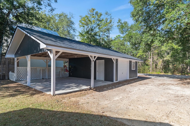 view of vehicle parking featuring a carport