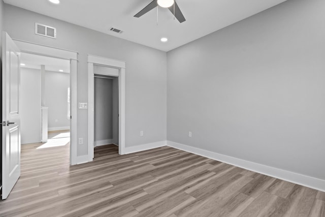 unfurnished bedroom featuring light wood-style floors, recessed lighting, visible vents, and baseboards