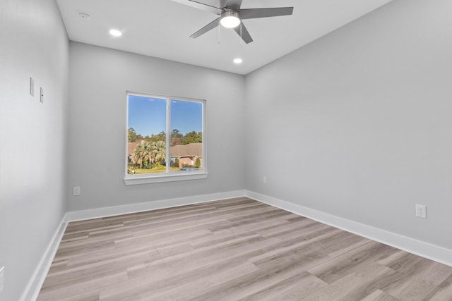 unfurnished room with ceiling fan and light hardwood / wood-style floors