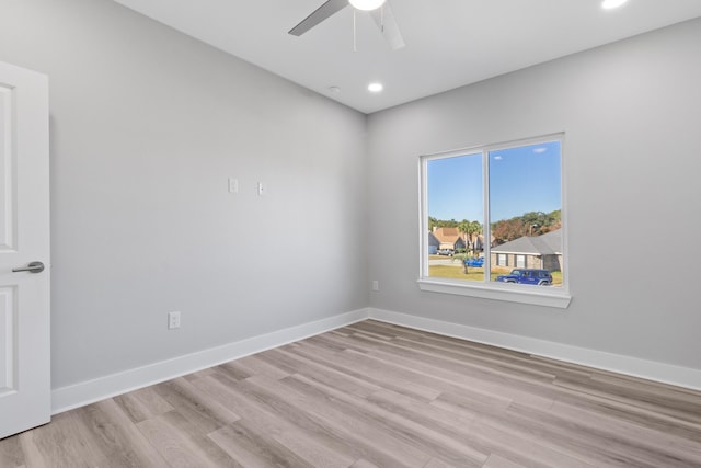 empty room with light wood-type flooring, baseboards, a ceiling fan, and recessed lighting