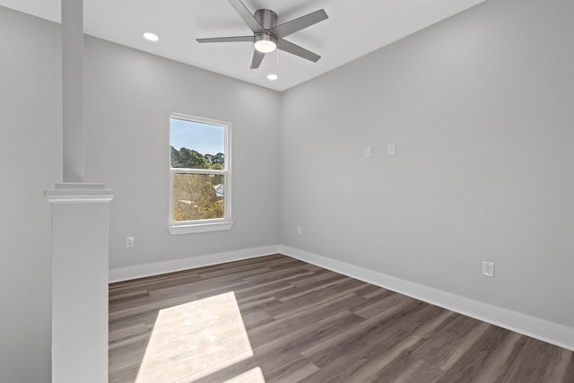 empty room with ceiling fan, recessed lighting, wood finished floors, and baseboards