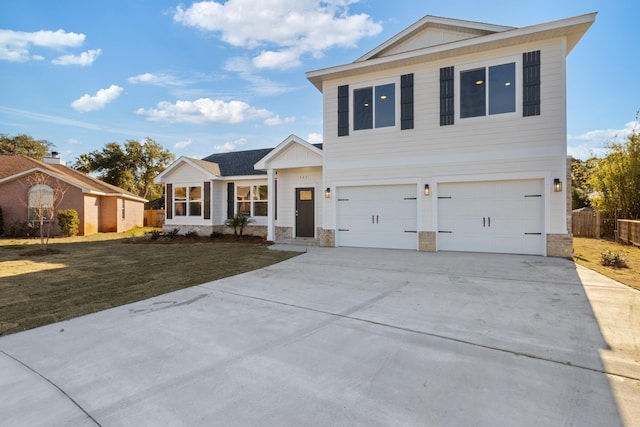 view of front of house featuring a garage and a front yard