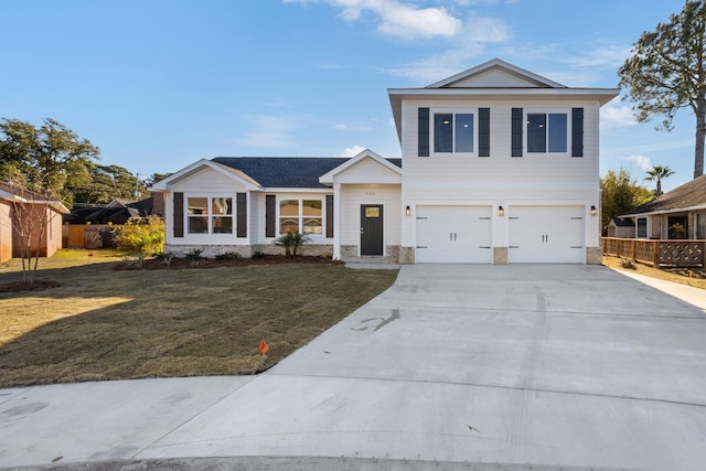 view of front of home with a garage and a front yard