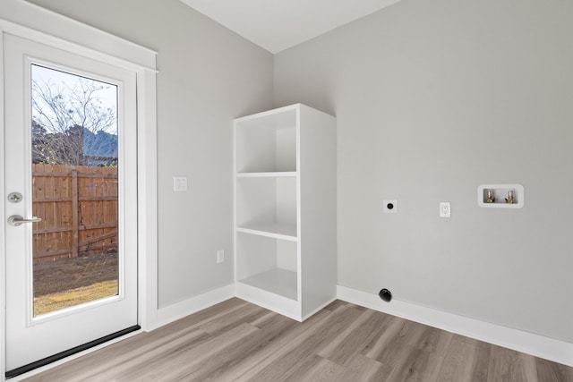 laundry area with washer hookup, hookup for an electric dryer, wood finished floors, laundry area, and baseboards