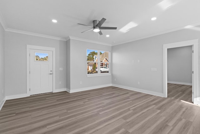 entryway featuring ceiling fan, light hardwood / wood-style flooring, and ornamental molding