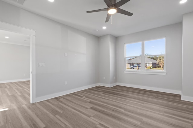 spare room featuring recessed lighting, visible vents, baseboards, and wood finished floors