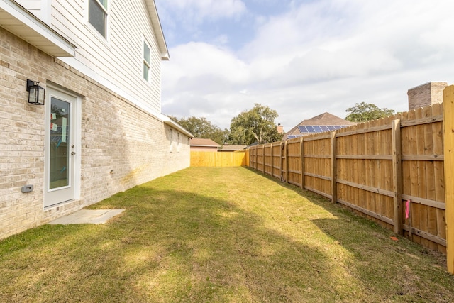 view of yard featuring a fenced backyard