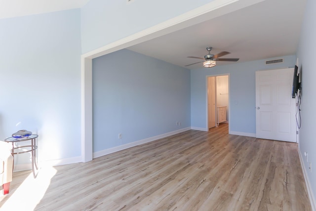 empty room featuring ceiling fan and light hardwood / wood-style floors