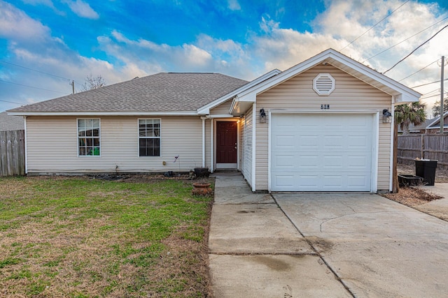 ranch-style home featuring a garage and a front yard