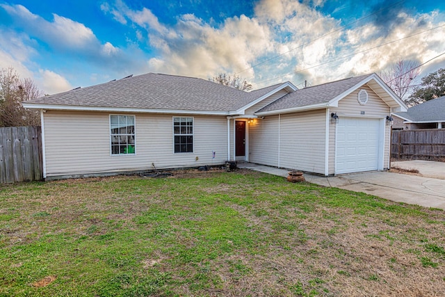 single story home with a garage and a front lawn