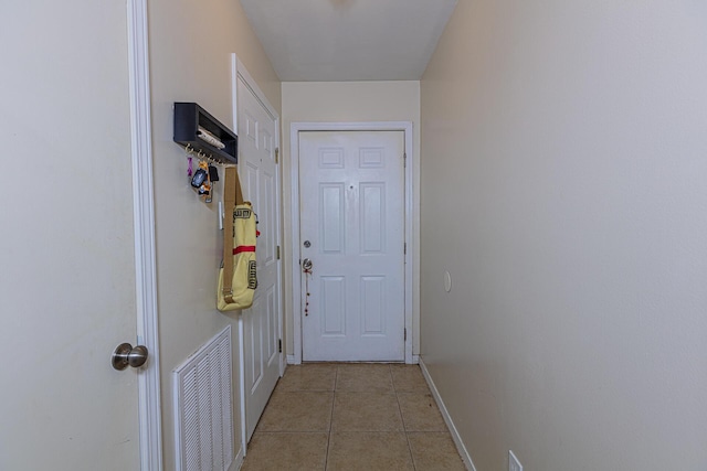 entryway featuring light tile patterned floors