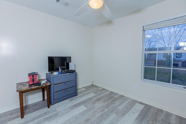 interior space with ceiling fan and light wood-type flooring