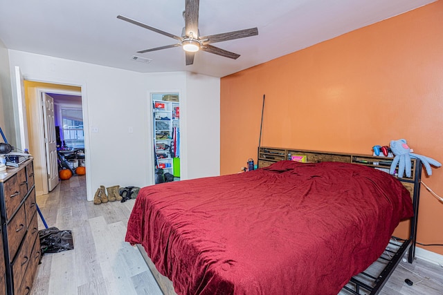 bedroom featuring ceiling fan and light hardwood / wood-style flooring