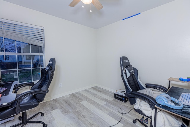 office area with ceiling fan and light hardwood / wood-style flooring