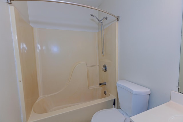 full bathroom featuring vanity, bathtub / shower combination, and toilet