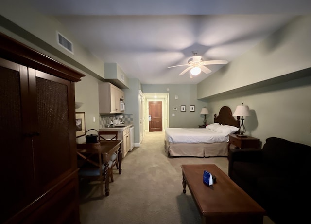 bedroom featuring ceiling fan and light colored carpet