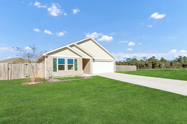 view of front of property featuring a garage and a front yard